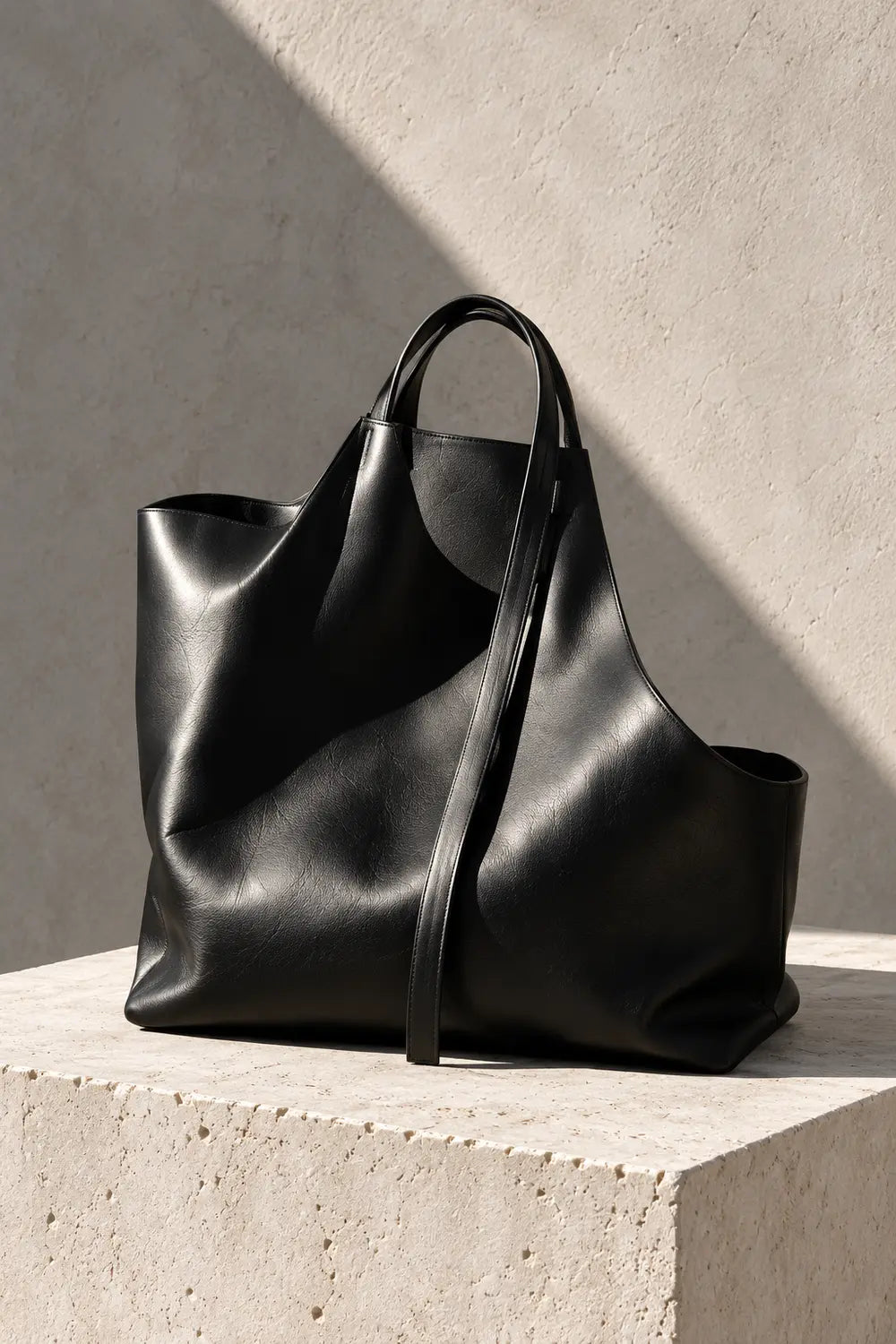 Black leather tote — editorial visualization
