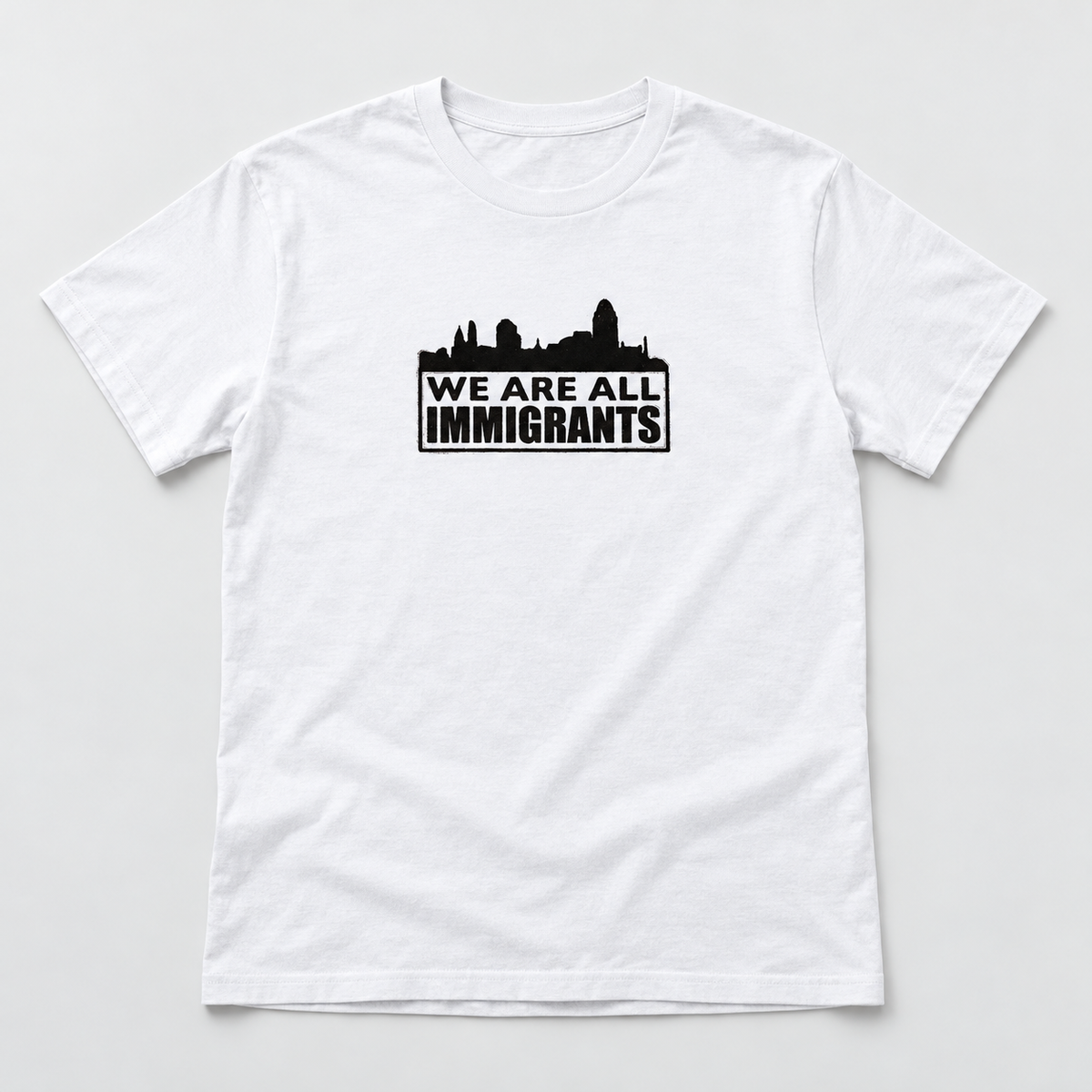 Encuentro T-Shirt — white with black print — studio view